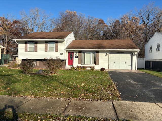 201 East Rose Street Glenwood, IL 60425 - Photo 46 of 49 a front view of a house with a yard and garage