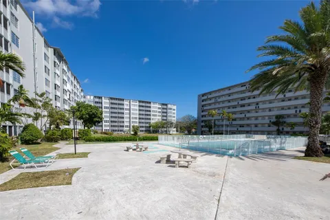 a view of building with outdoor space and seating area