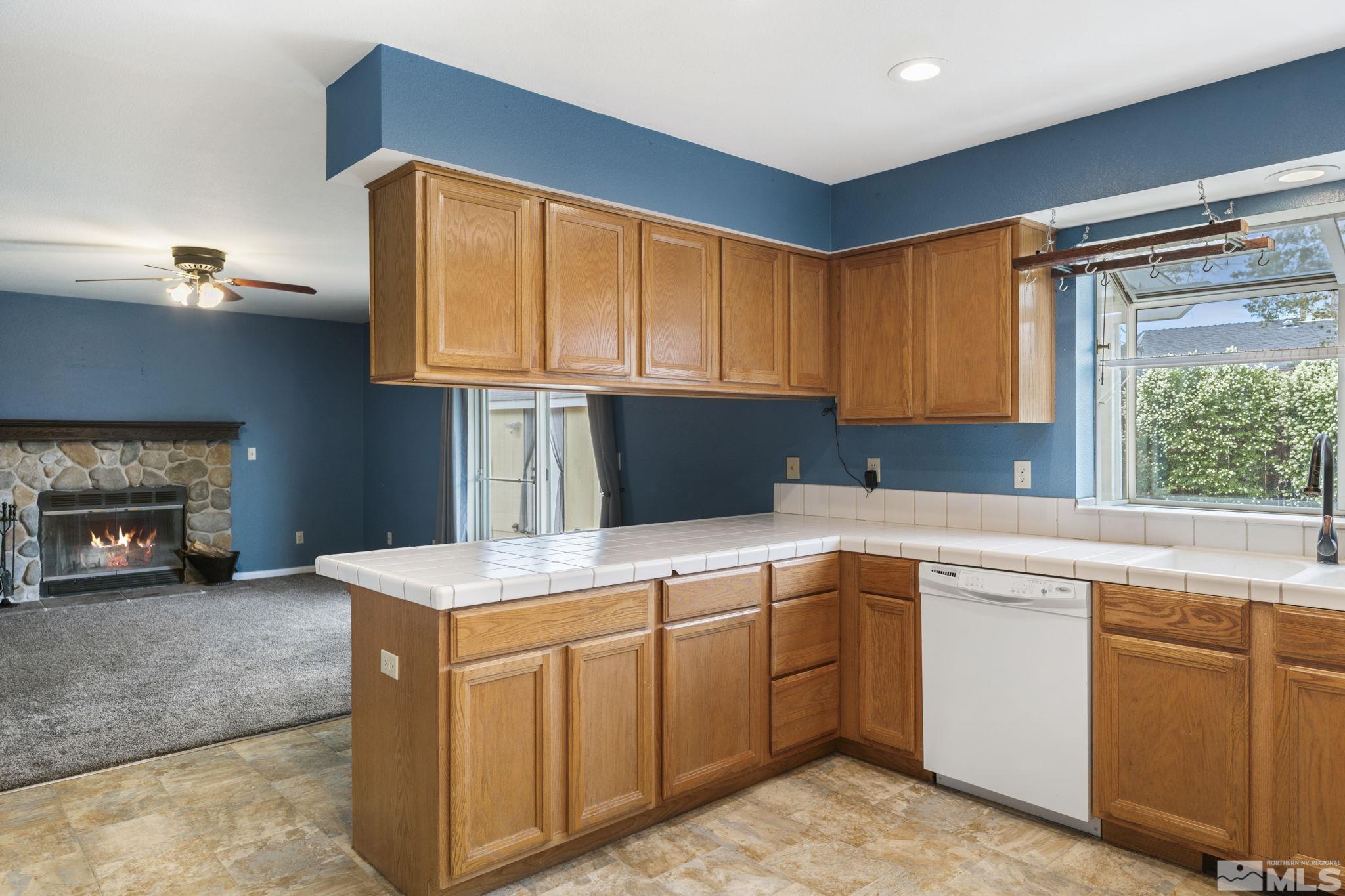 403 Aspen Drive Dayton, NV 89403 - Photo 12 of 36 a kitchen with a cabinets and sink