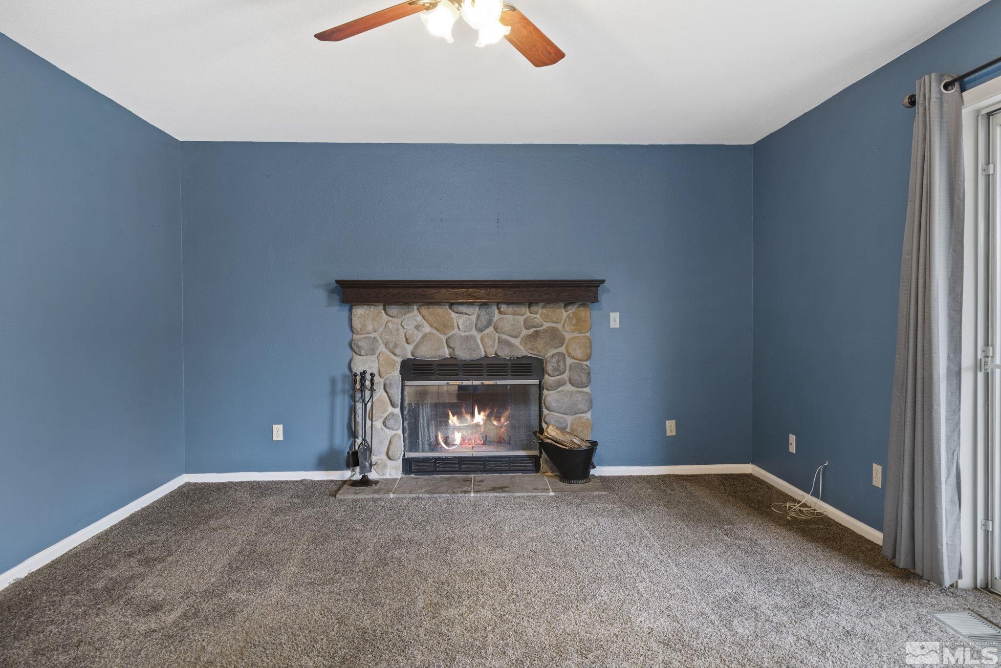 403 Aspen Drive Dayton, NV 89403 - Photo 13 of 36 a view of empty room with a fireplace