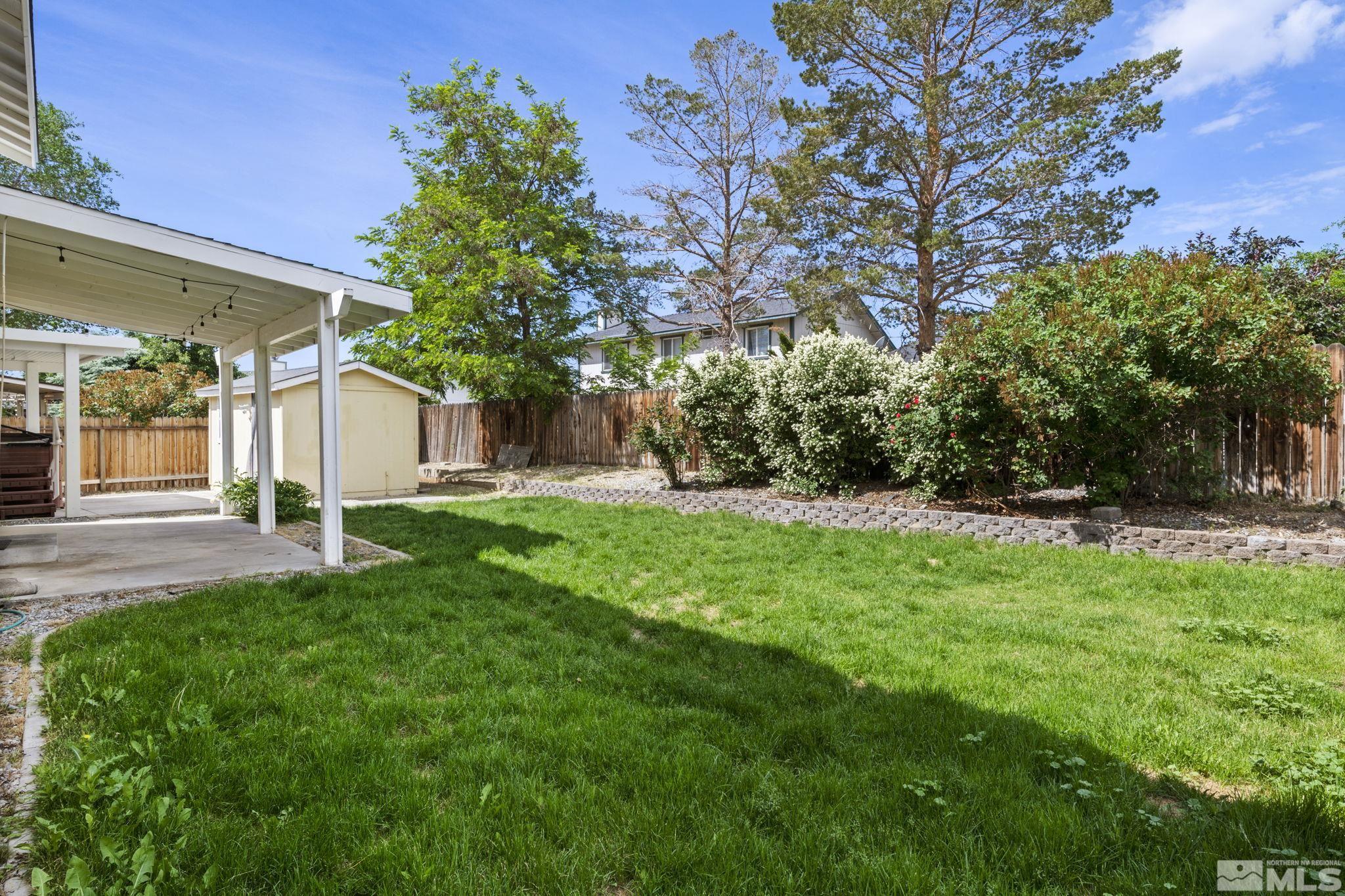 403 Aspen Drive Dayton, NV 89403 - Photo 29 of 36 a view of a house with backyard and a tree