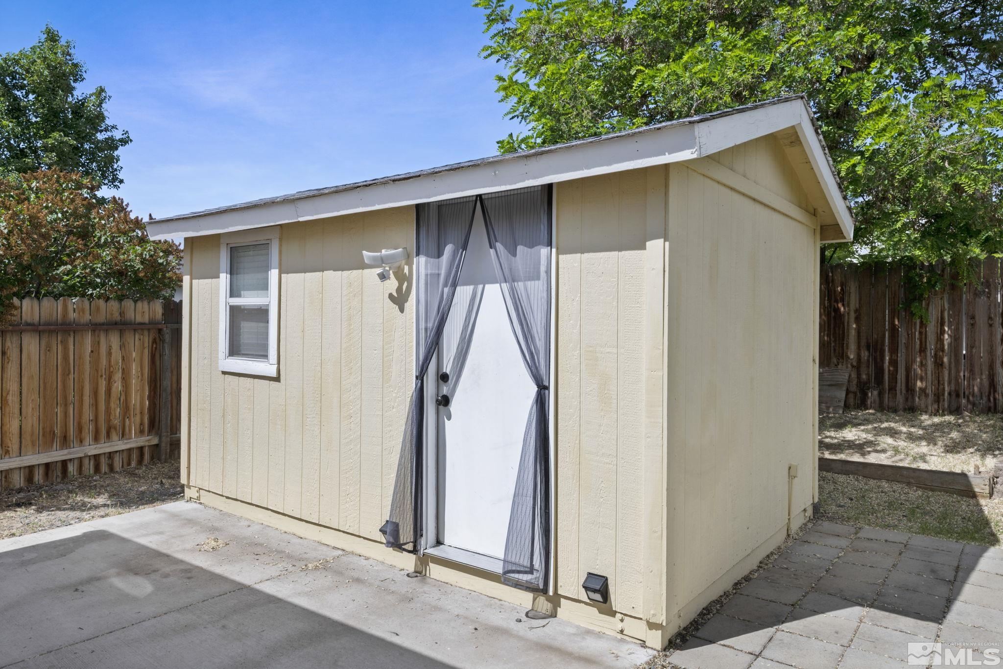 403 Aspen Drive Dayton, NV 89403 - Photo 30 of 36 a view of a house with a wooden fence
