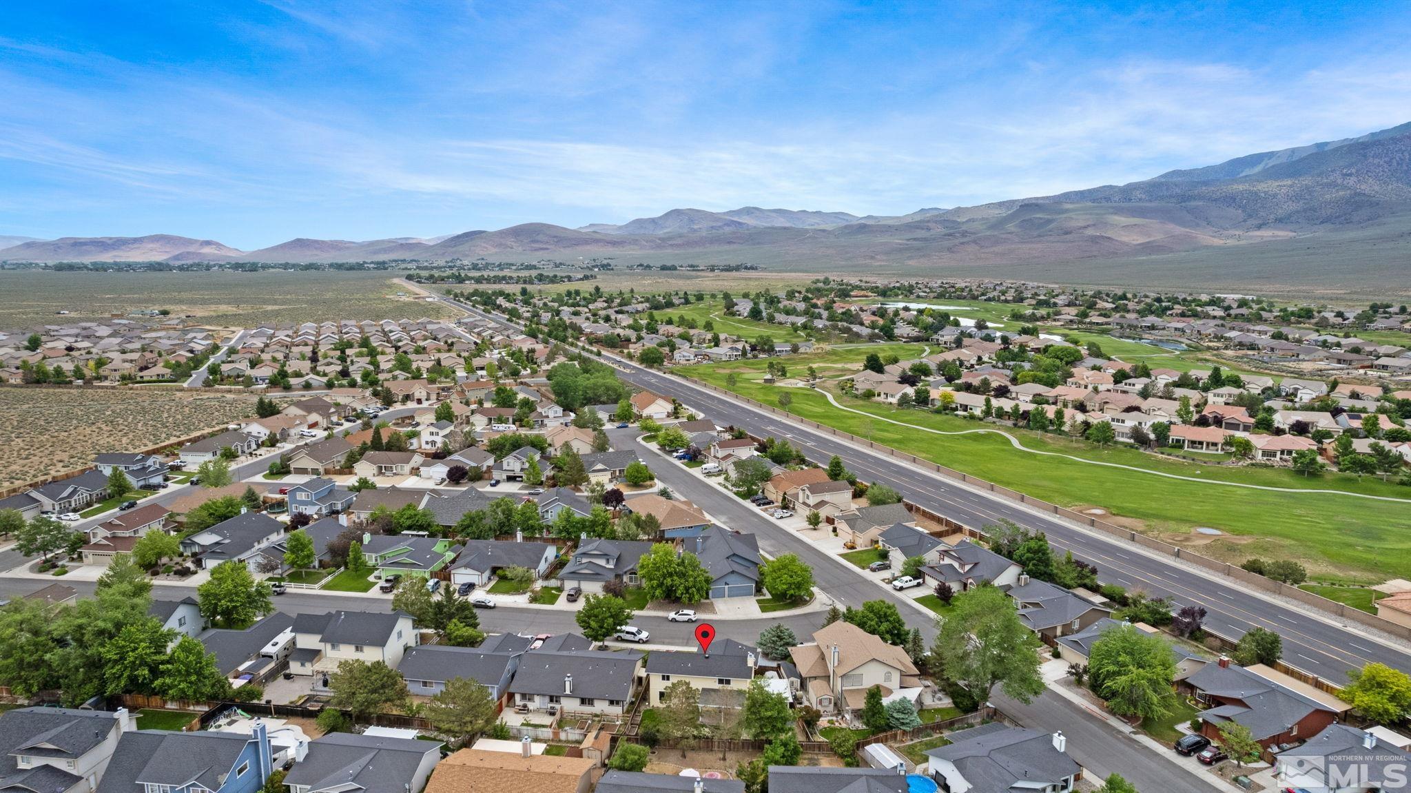 403 Aspen Drive Dayton, NV 89403 - Photo 3 of 36 an aerial view of a city with mountains
