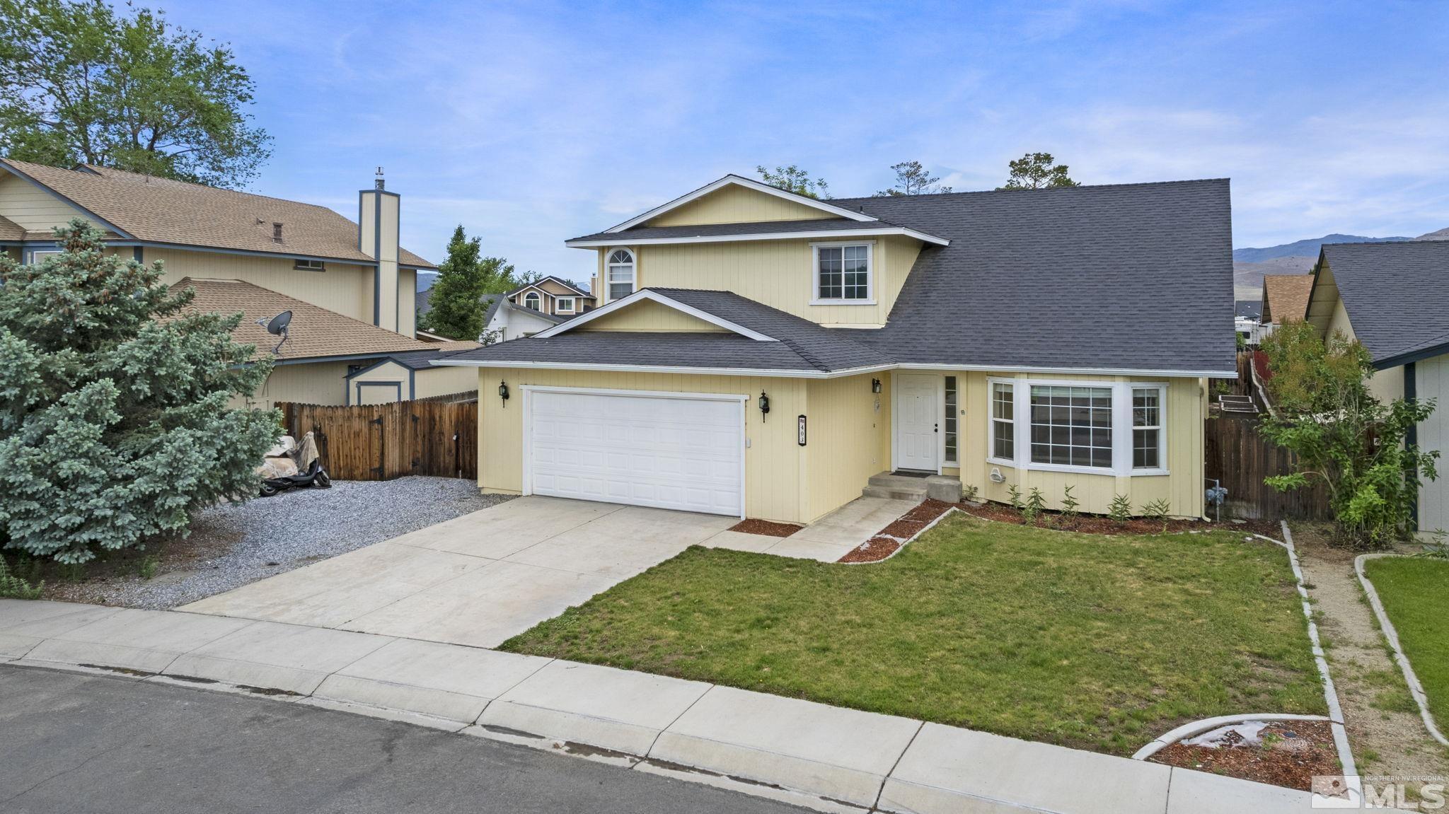 403 Aspen Drive Dayton, NV 89403 - Photo 6 of 36 a front view of a house with a yard