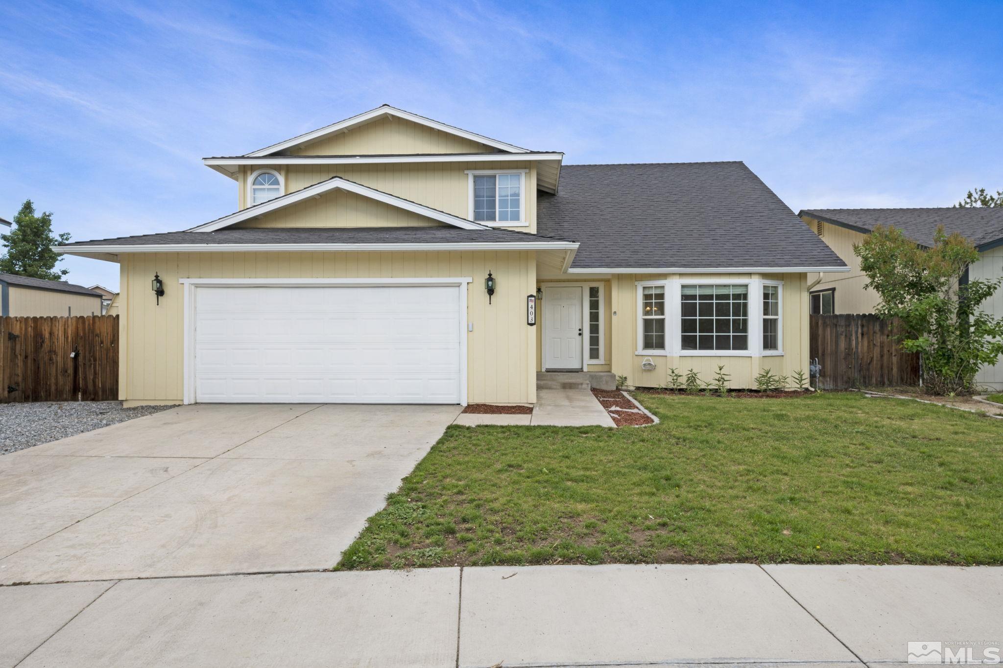 403 Aspen Drive Dayton, NV 89403 - Photo 7 of 36 a front view of a house with a yard