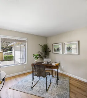 a workspace with furniture and window