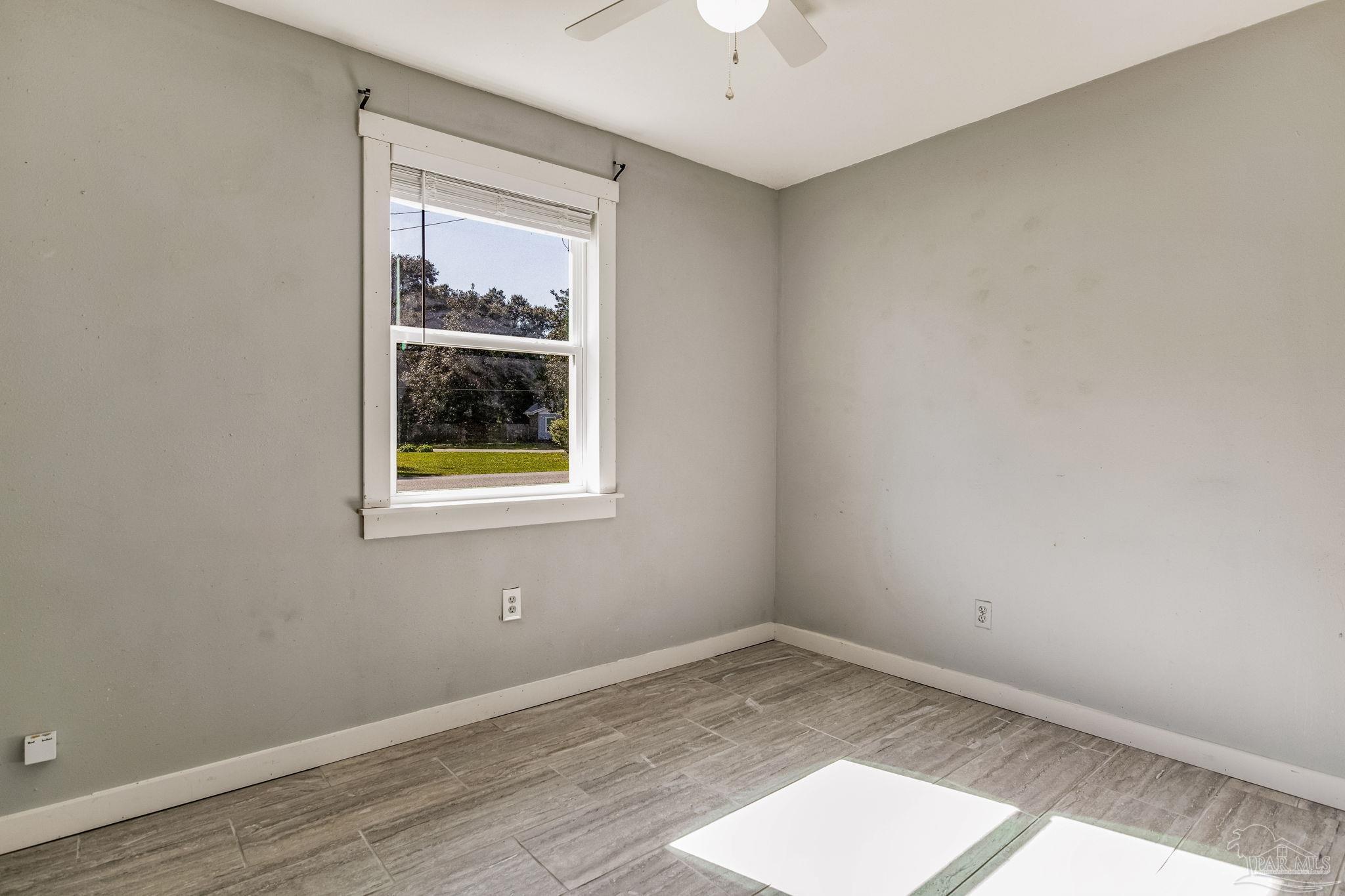 5254 Jenny Circle Pace, FL 32571 - Photo 27 of 44 an empty room with a window
