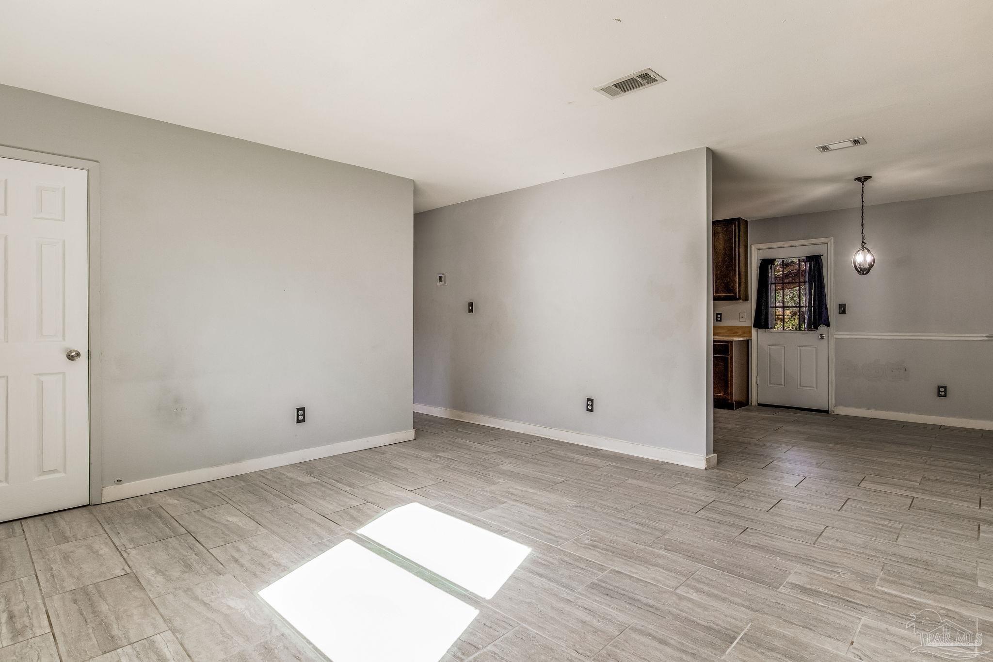 5254 Jenny Circle Pace, FL 32571 - Photo 5 of 44 wooden floor in an empty room