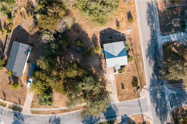 an aerial view of a house with outdoor space