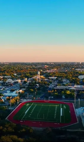 a bedroom with furniture and a wooden floor