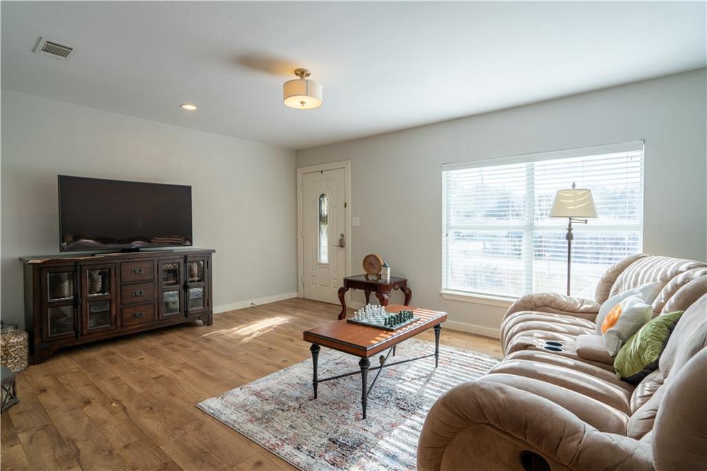 301 North Lewis Street Round Rock, TX 78664 - Photo 7 of 12 a living room with furniture and a flat screen tv