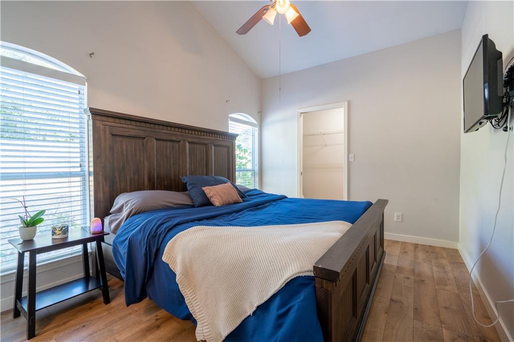 301 North Lewis Street Round Rock, TX 78664 - Photo 8 of 12 a bedroom with a bed and a flat screen tv