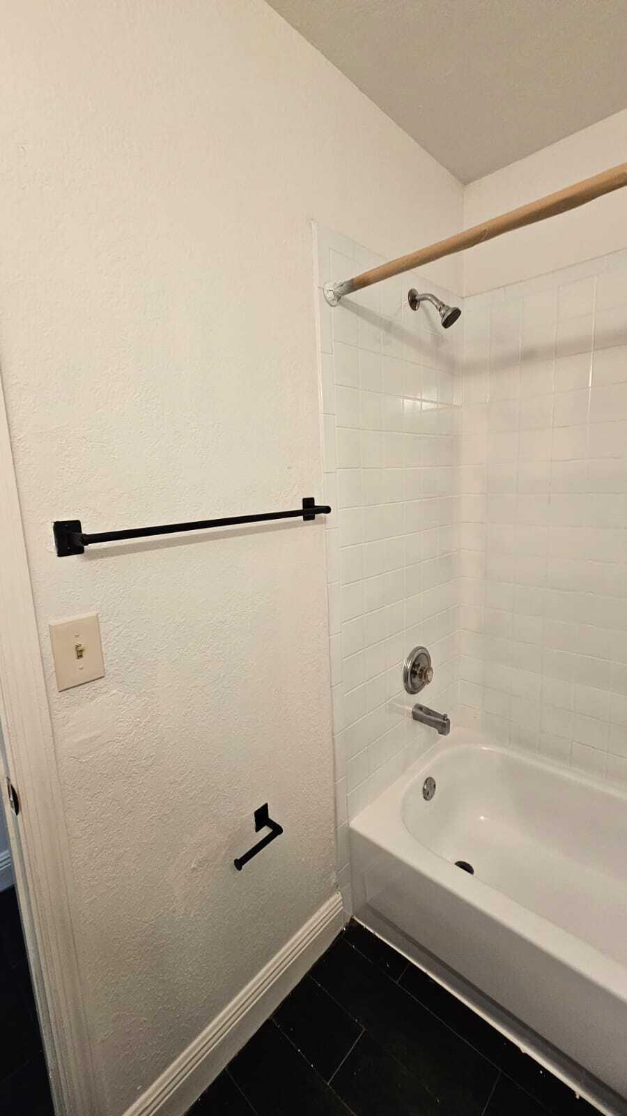 3391 Avenue South Riviera Beach, FL 33404 - Photo 15 of 16 a bathroom with a bathtub and a shower