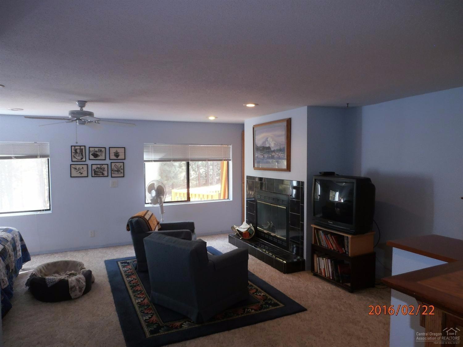 60330 East Ridgeview Drive Bend, OR 97702 - Photo 15 of 25 Master sitting area with gas fireplace