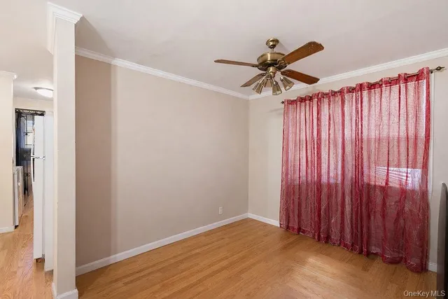 a large bed sitting in a bedroom next to a window