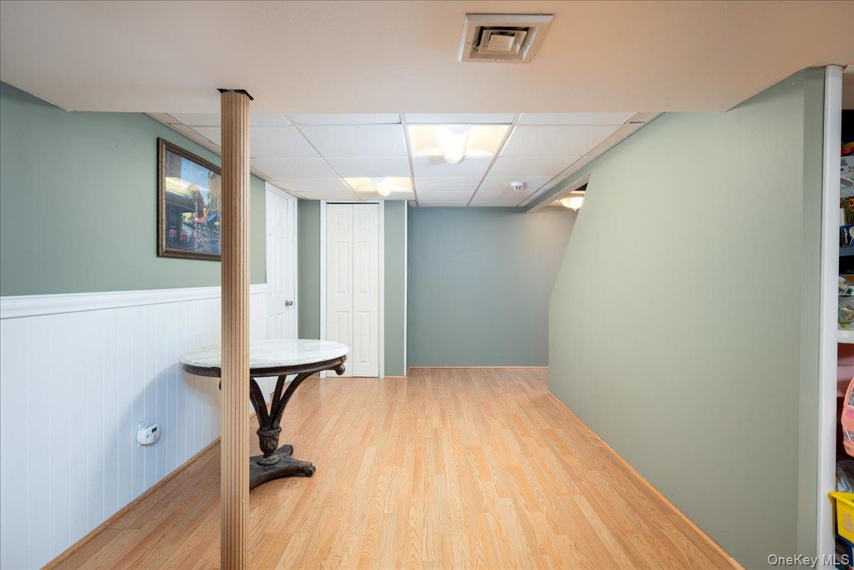 11 Adelphi Road Hicksville, NY 11801 - Photo 20 of 26 a view of a room with wooden floor