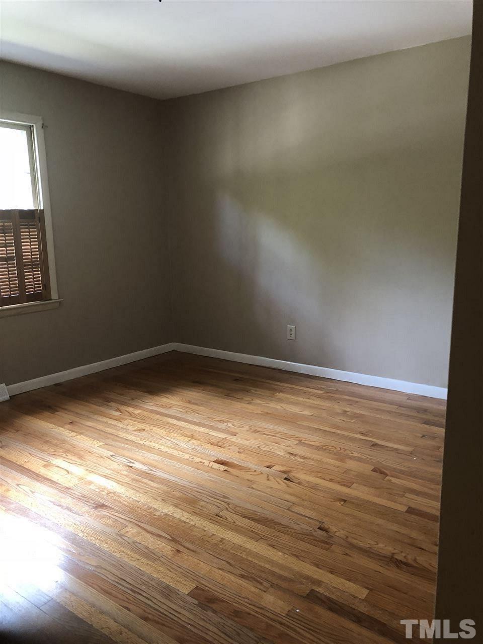 822 Chatham Lane Raleigh, NC 27610 - Photo 8 of 13 a view of empty room with wooden floor