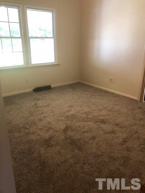822 Chatham Lane Raleigh, NC 27610 - Photo 9 of 13 an empty room with a window