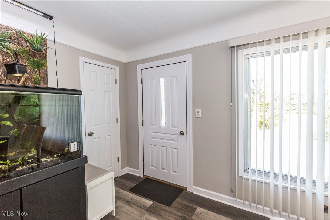 2430 Rockside Road Independence, OH 44131 - Photo 5 of 46 Foyer entrance featuring dark wood finished floors and baseboards