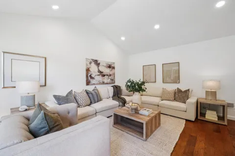 a view of a patio with table and chairs and potted plants