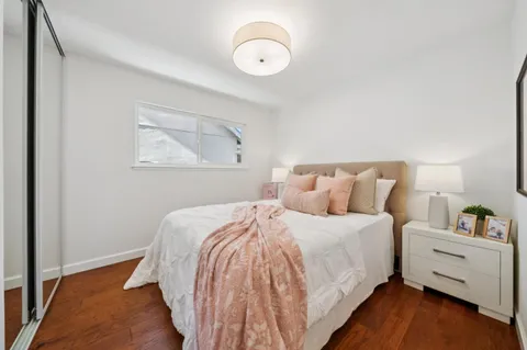 a bathroom with a granite countertop sink a toilet and shower