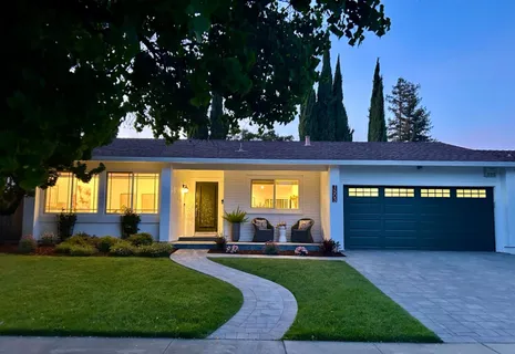 a view of living room with furniture and a wooden floor