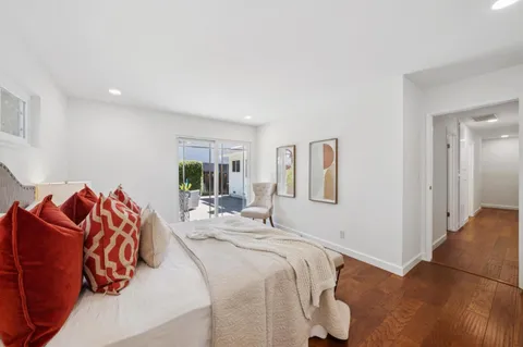 a view of a patio with furniture and plants