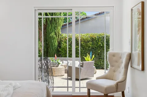 a view of a patio with couches and potted plants