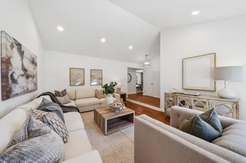 a kitchen with white cabinets stainless steel appliances and sink