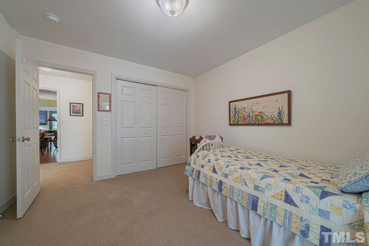 2617 Grant Avenue Raleigh, NC 27608 - Photo 15 of 28 a bedroom with two beds and a painting on the wall