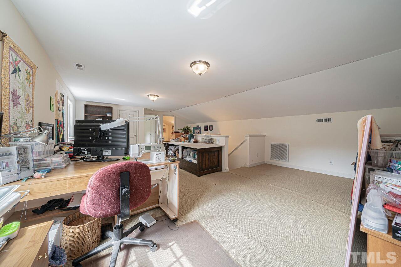 2617 Grant Avenue Raleigh, NC 27608 - Photo 22 of 28 a living room with furniture and a flat screen tv