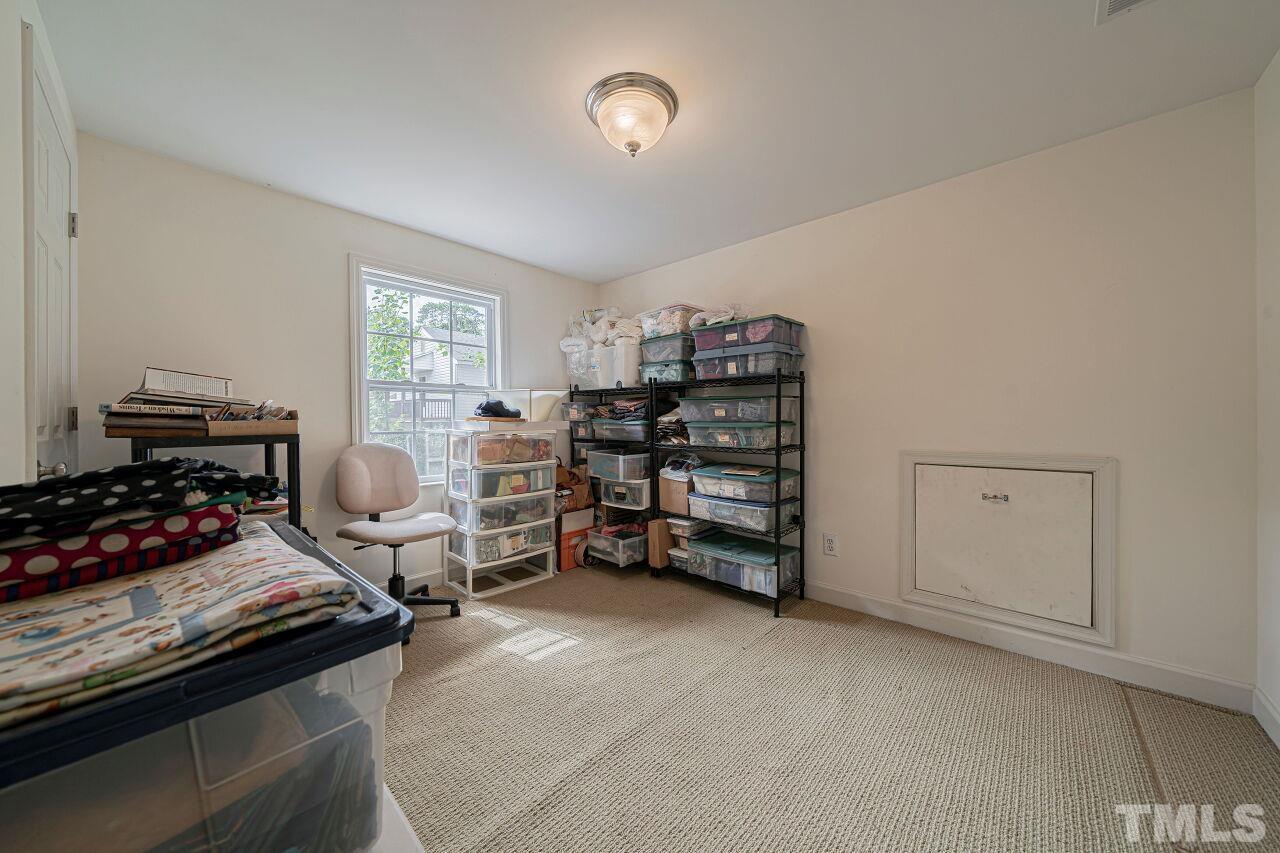2617 Grant Avenue Raleigh, NC 27608 - Photo 23 of 28 a bedroom with furniture and a window