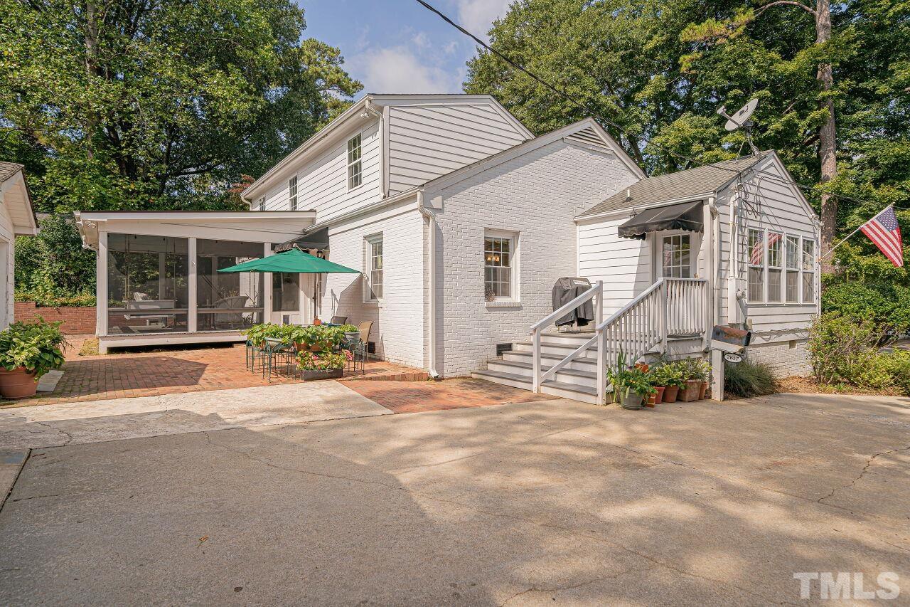 2617 Grant Avenue Raleigh, NC 27608 - Photo 27 of 28 a view of a house with a yard and potted plants