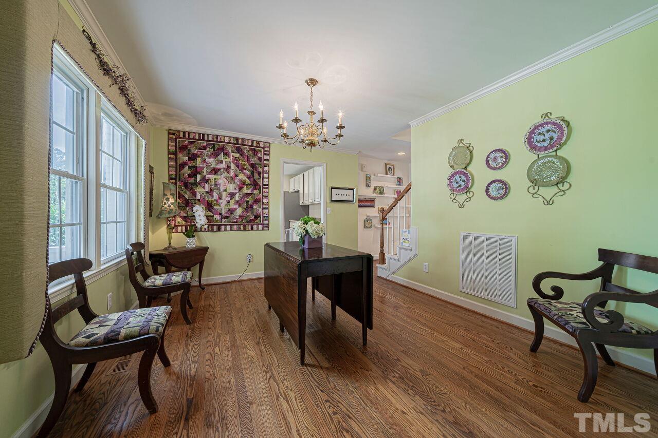 2617 Grant Avenue Raleigh, NC 27608 - Photo 9 of 28 a view of a dining room with furniture and wooden floor
