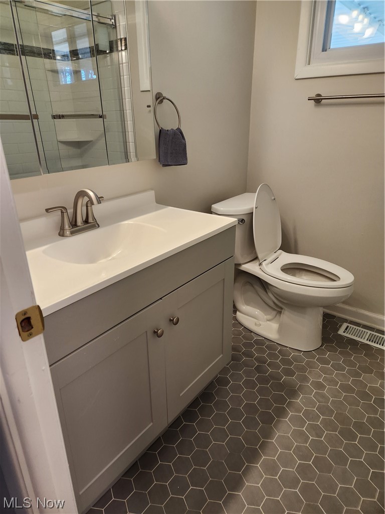 4660 West Farnhurst Road South Euclid, OH 44121 - Photo 9 of 17 Bathroom with toilet, tile flooring, and oversized vanity
