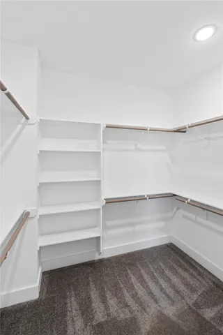 a view of an empty walk in closet