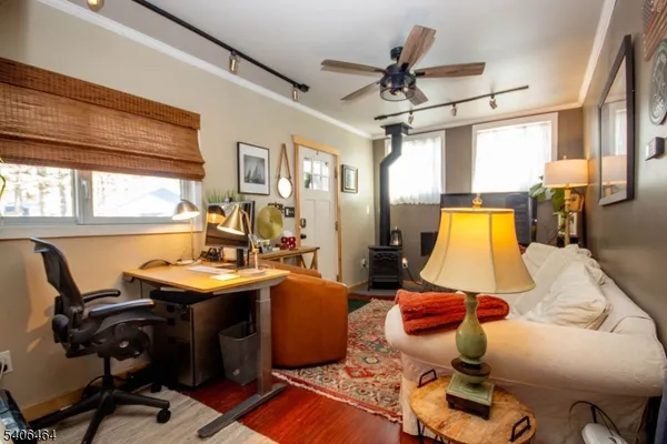 a view of a livingroom with furniture and a window