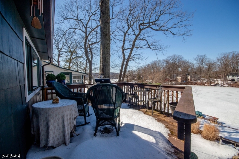 70 South Shore Road Andover, NJ 07821 - Photo 18 of 25 a view of balcony with chairs and wooden fence