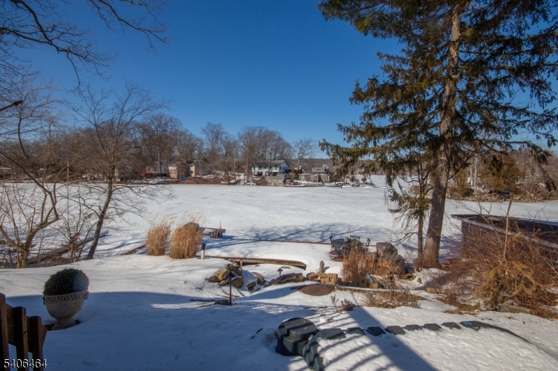 70 South Shore Road Andover, NJ 07821 - Photo 2 of 25 a view of a lake with a car parked on the road