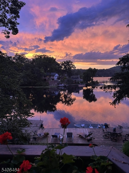 70 South Shore Road Andover, NJ 07821 - Photo 22 of 28 a view of a lake in middle of the sunset