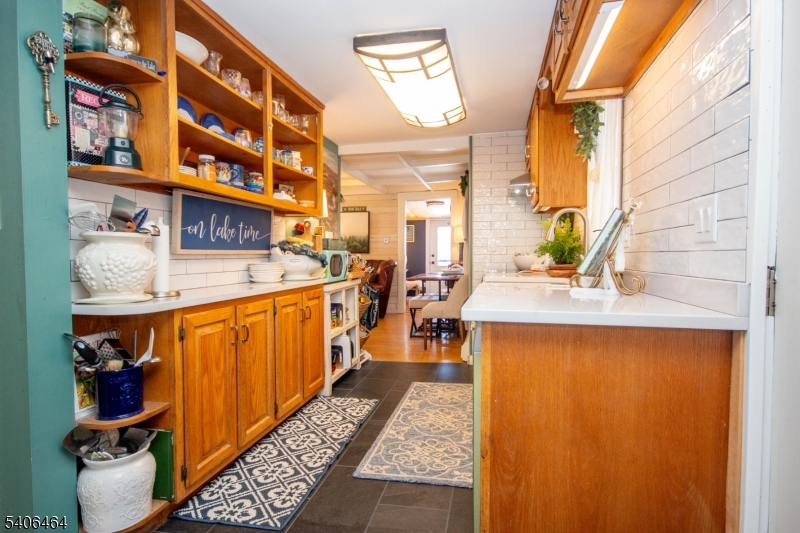 70 South Shore Road Andover, NJ 07821 - Photo 3 of 25 a kitchen with stainless steel appliances granite countertop a sink dishwasher stove and cabinets