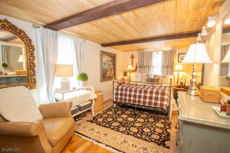 70 South Shore Road Andover, NJ 07821 - Photo 5 of 28 a bedroom with furniture and a large window