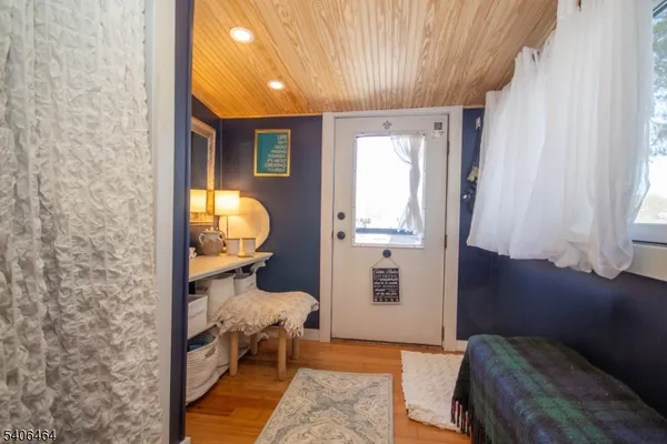 a bedroom with furniture and a window