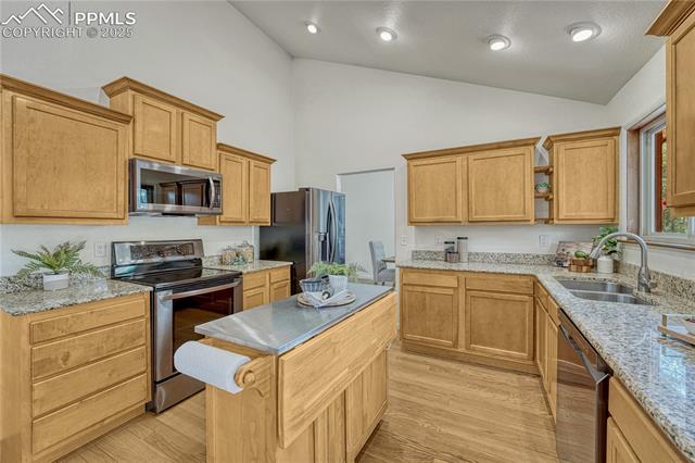 26 Mountain View Road Manitou Springs, CO 80829 - Photo 9 of 48 LG appliances include a glass top range, large microwave oven, refrigerator with in-door ice maker, and dishwasher