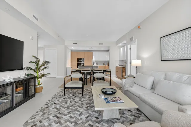 a bedroom with a bed and flat screen tv