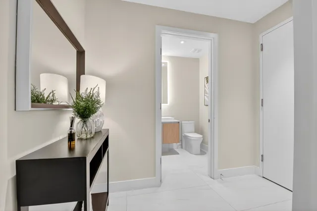 a view of a balcony with chair and floor to ceiling window