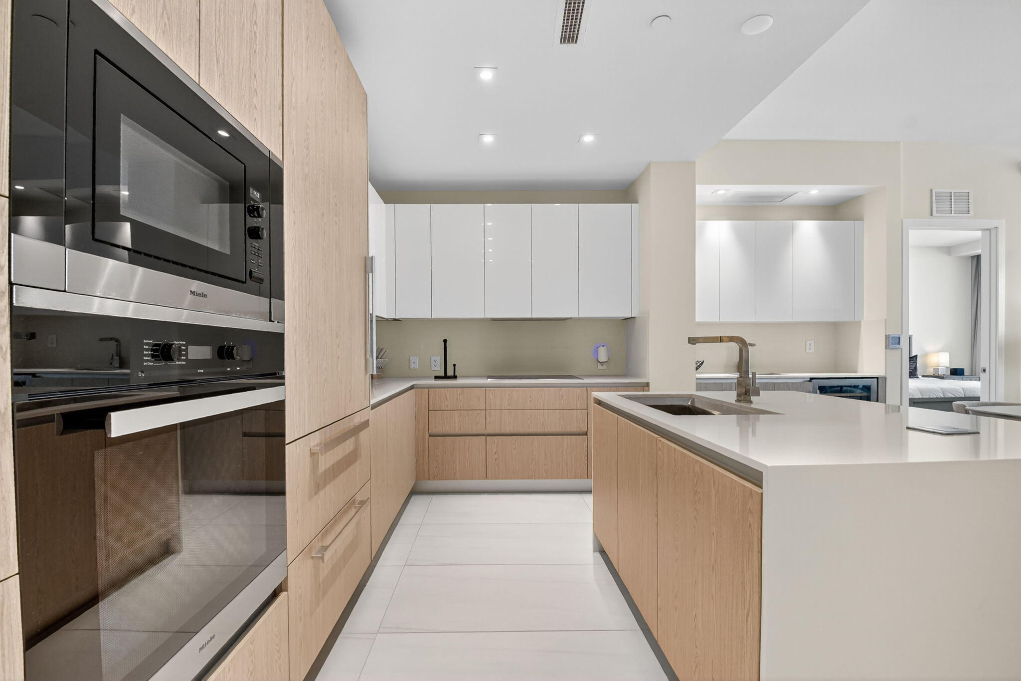 3100 North Ocean Drive, Unit 1210H Singer Island, FL 33404 - Photo 18 of 93 a kitchen with stainless steel appliances granite countertop a sink and cabinets