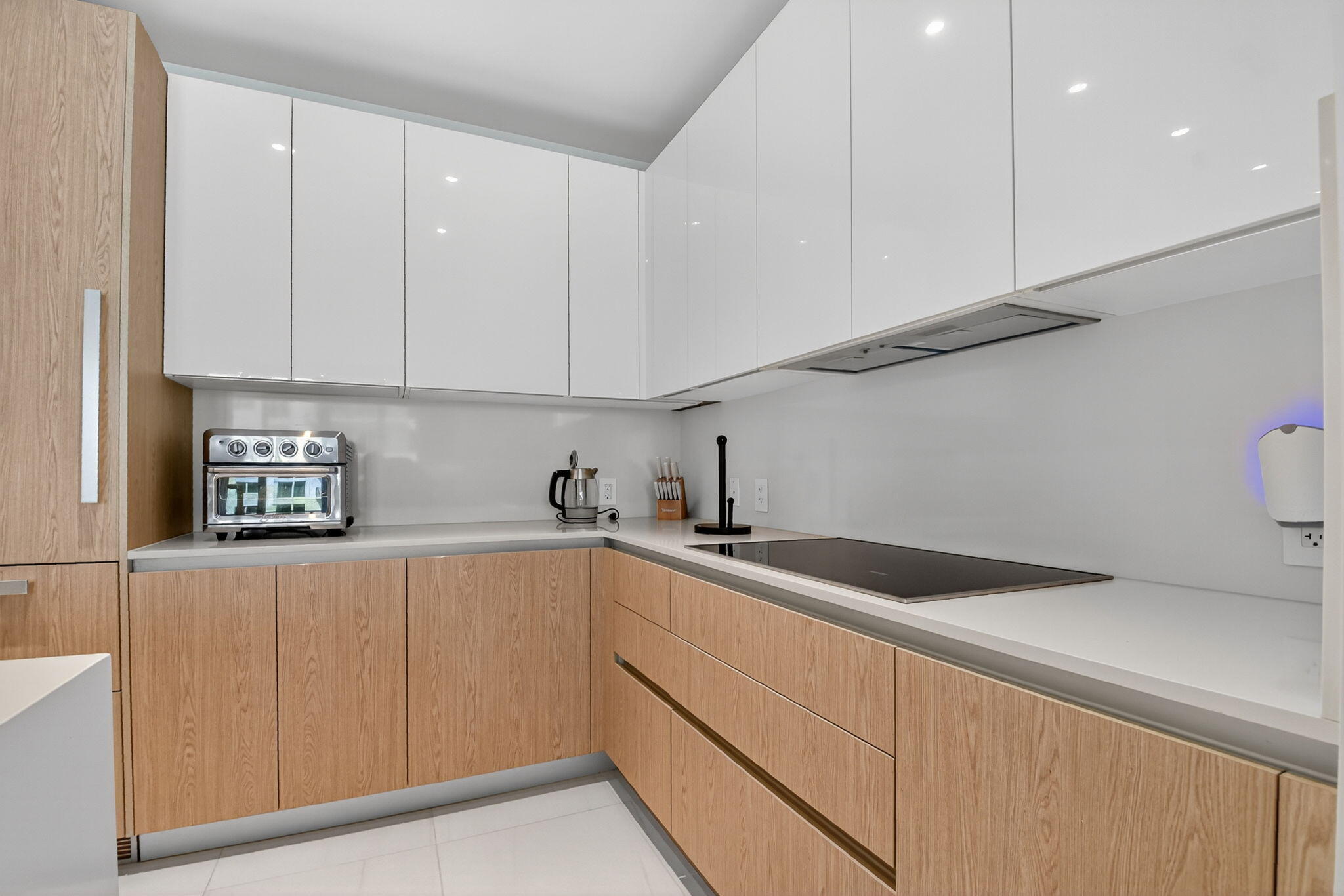 3100 North Ocean Drive, Unit 1210H Singer Island, FL 33404 - Photo 20 of 93 a kitchen with a sink and cabinets