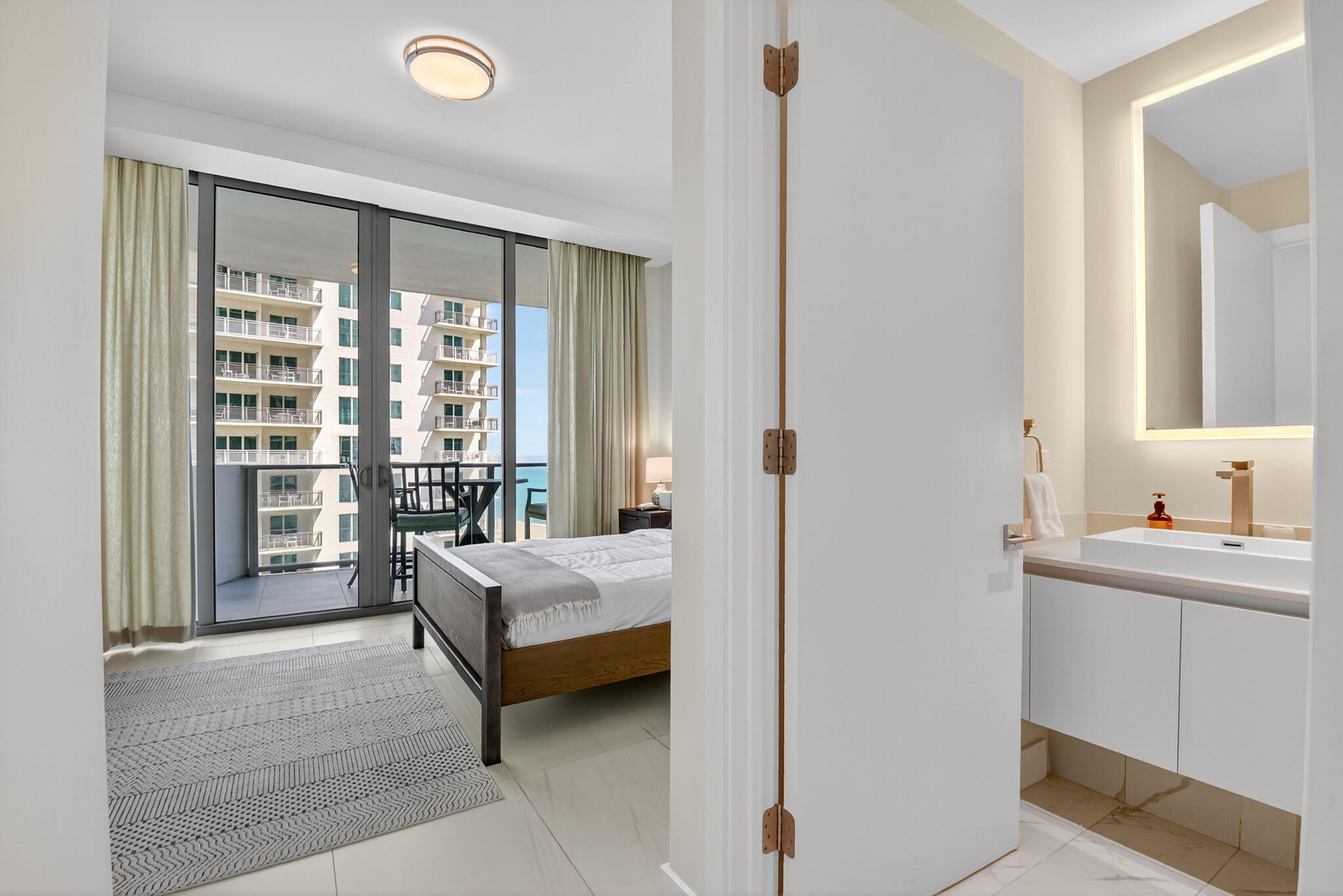 3100 North Ocean Drive, Unit 1210H Singer Island, FL 33404 - Photo 32 of 93 a bedroom with a bed and a window