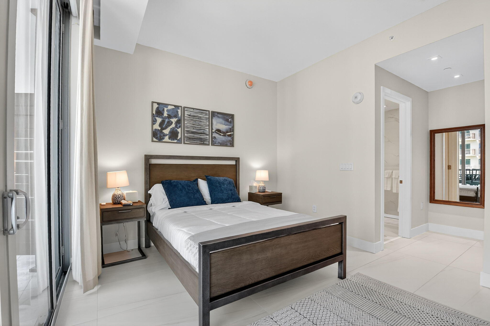 3100 North Ocean Drive, Unit 1210H Singer Island, FL 33404 - Photo 35 of 93 a bedroom with a bed and a couch